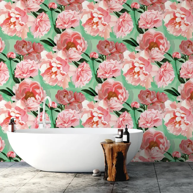 Modern bathroom with white tub, wood stool, and floral wallpaper featuring pink and green peonies.