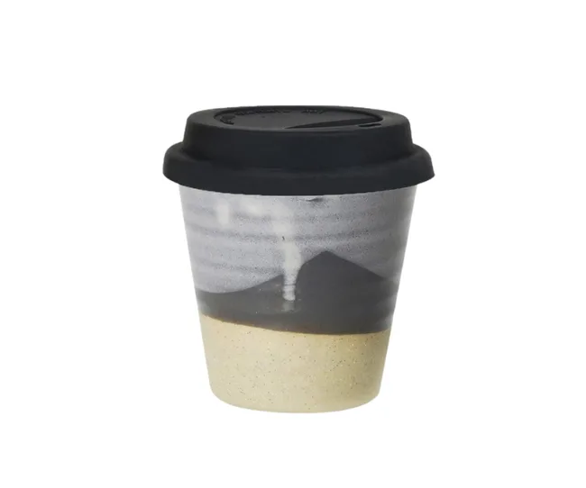 Ceramic travel coffee cup with black lid and a gray and beige design.