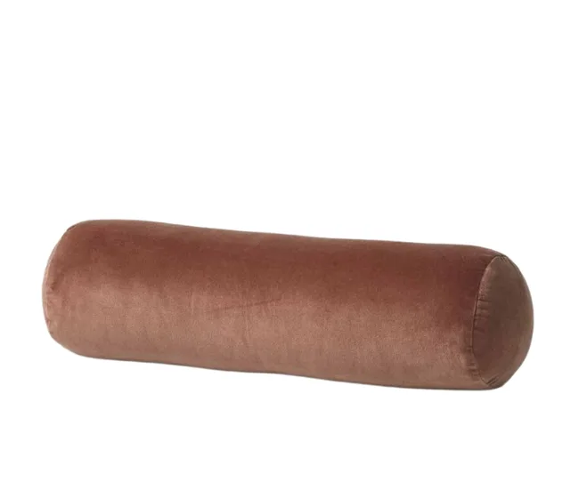 A cylindrical brown bolster pillow with a soft fabric texture on a white background.