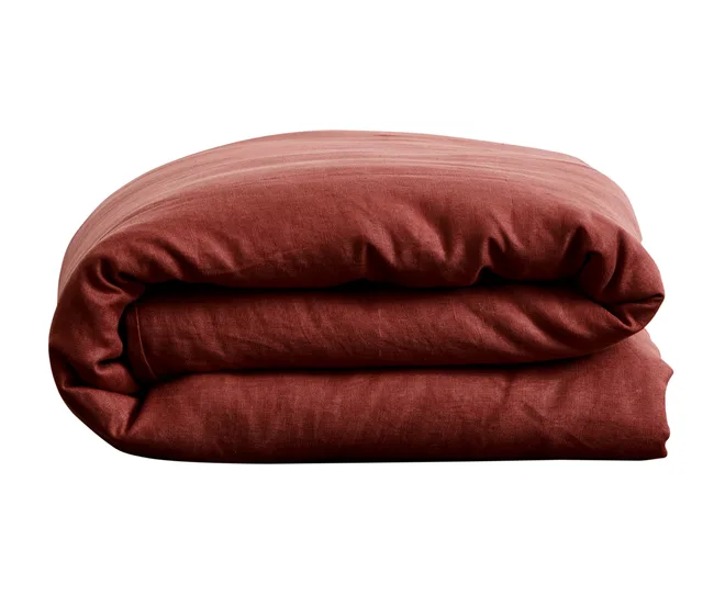 Folded red duvet cover against a white background.
