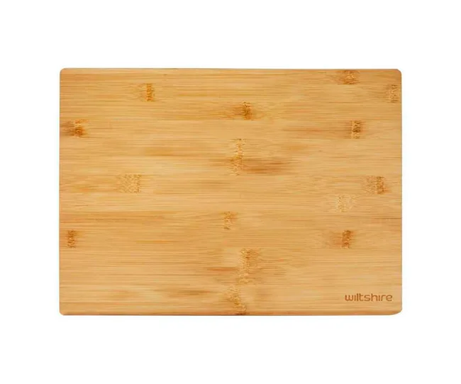 Wooden cutting board with "Wiltshire" logo in the bottom right corner. Light brown, rectangular shape.