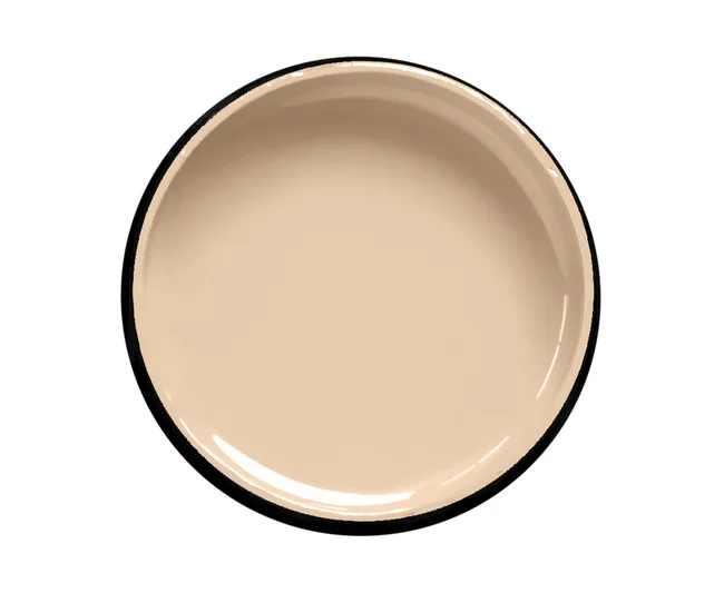 Cream-colored enamel plate with a black rim, viewed from above on a white background.