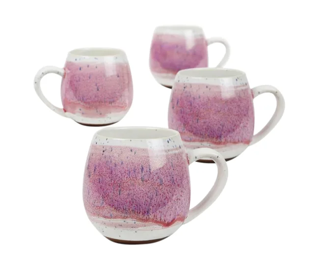 Set of four round ceramic mugs with pink and white glaze on a white background.