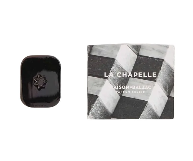 Maison Balzac La Chapelle solid perfume with black star-shaped design and geometric packaging.