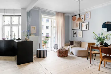 Clever furniture choices make this small apartment the perfect home for two