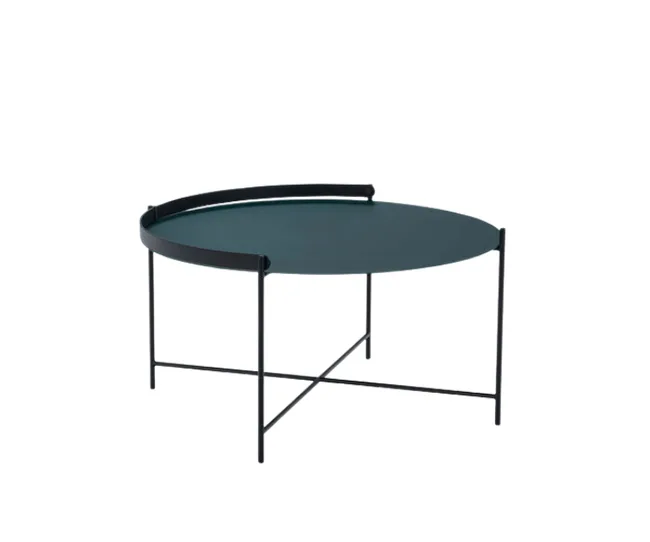 Round metal coffee table with teal top and black minimalist frame, featuring a partial raised edge on one side.