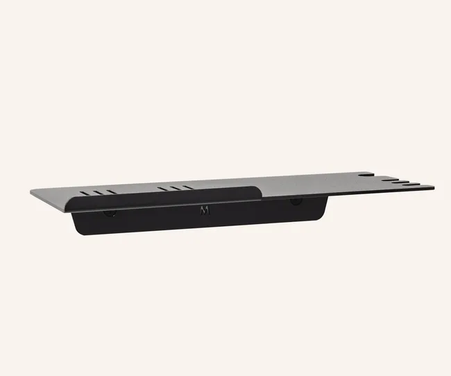 Slim, rectangular gray wall shelf with black accents on an off-white background.