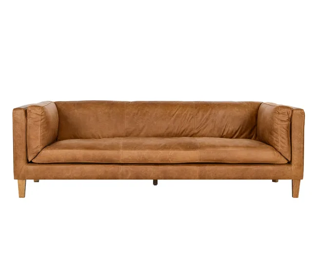 Brown leather couch with wooden legs on a white background.