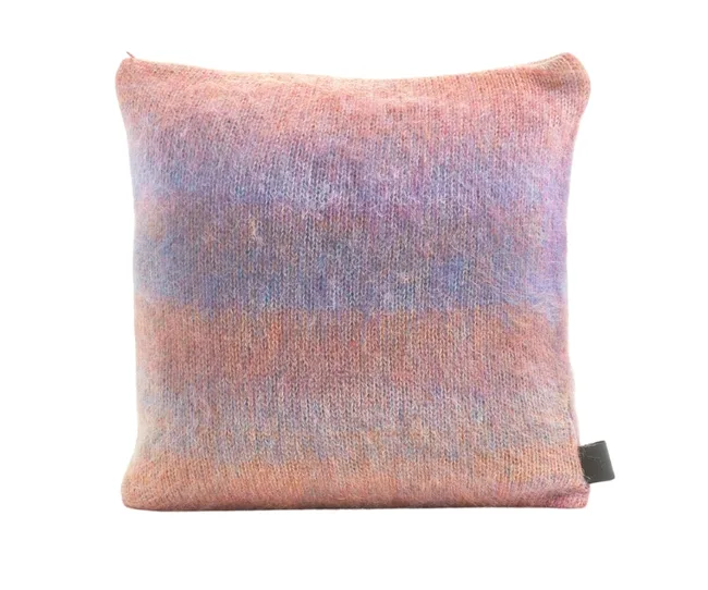 Multicolored woolen cushion with a soft, fuzzy texture in shades of purple, pink, and orange.