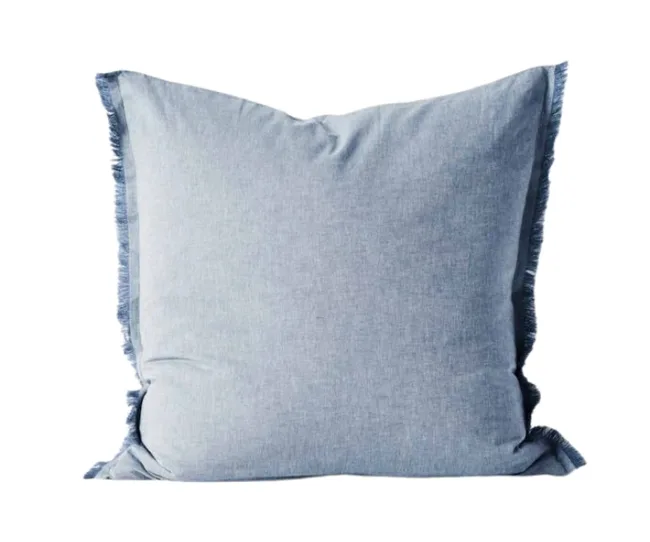 A square blue pillow with a subtle fringe along the edges on a white background.