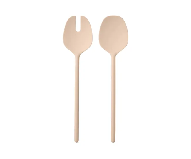 A set of beige salad servers, one with a forked end and one a spoon, on a white background.