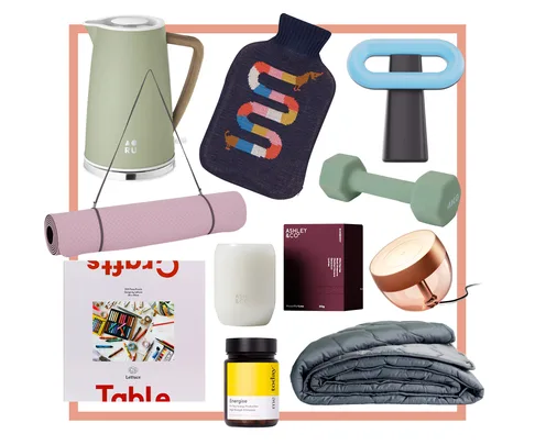 Assorted lifestyle items including a kettle, dumbbell, yoga mat, puzzle, and weighted blanket.