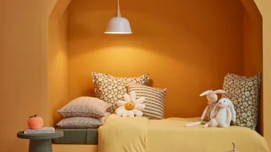 How to create a child’s bed nook with soft, warming hues