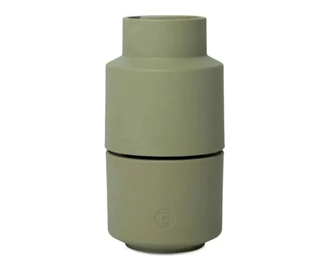 Green, cylindrical, modular vessel with a smooth matte finish, separated into two interlocking parts.