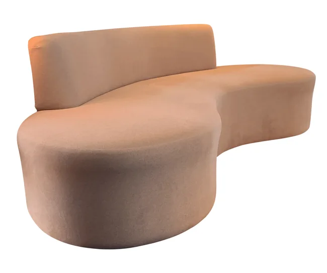 Curved beige modern sofa with a smooth surface and a low backrest.