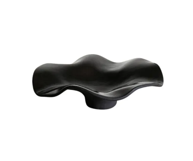 Black, wavy abstract sculpture or decorative bowl on a white background.