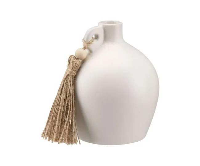 A white ceramic vase with a round body and a small handle, adorned with a beige twine tassel.