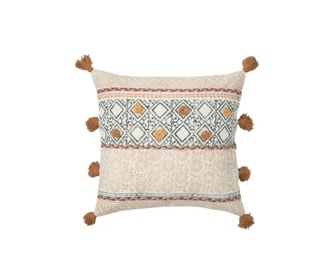 Decorative cushion with intricate geometric patterns and brown tassels on a neutral background.