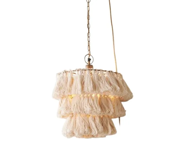 Hanging beige fringed pendant light with tassel design, suspended by a chain and electrical cord.
