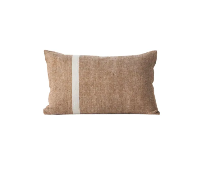 A rectangular brown linen pillow with a vertical white stripe on the left side.