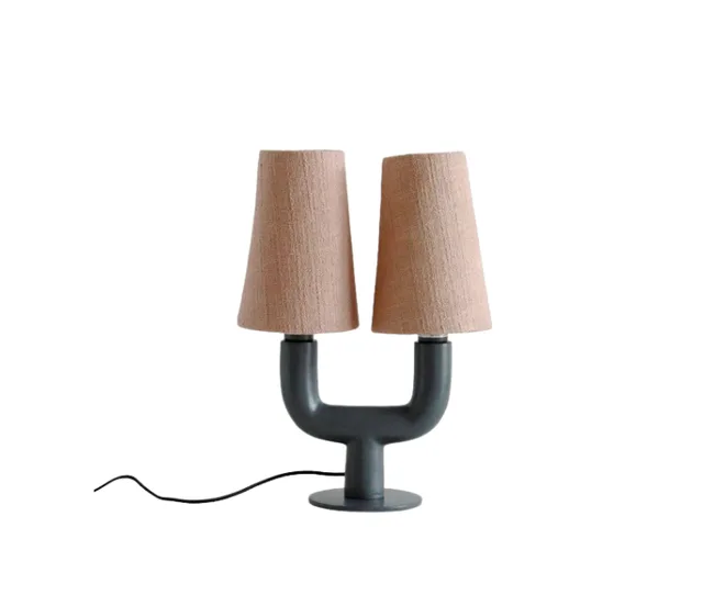 Dual-shaded table lamp with a black base and beige fabric lampshades on a white background.