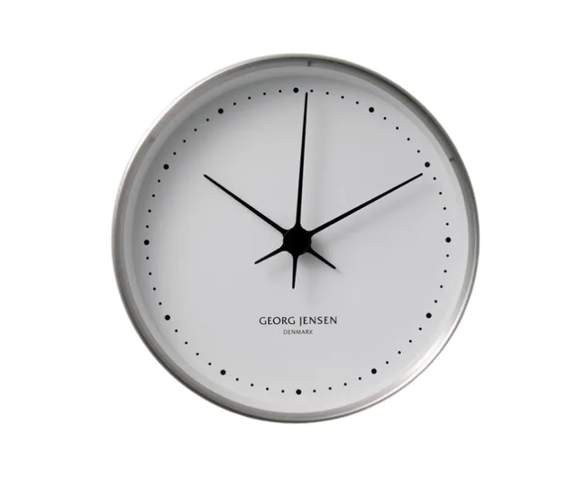 Wall clock with a white face, black hands, and dots for hour markers, designed by Georg Jensen, Denmark.
