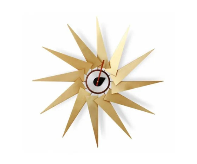 Gold starburst wall clock with angular design and a central red hour and minute hand.