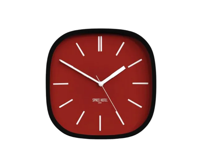 Red square wall clock with minimalist white hands and markers, labeled "Space Hotel" on the dial.