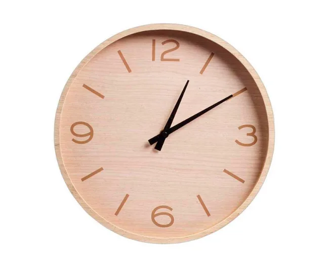 A minimalist round wall clock with a light wood face and black hands, showing 10:10.