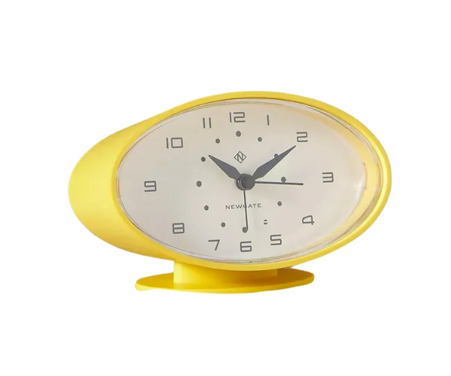 Yellow oval-shaped analog table clock with a Newgate logo and black hour, minute, and second hands.