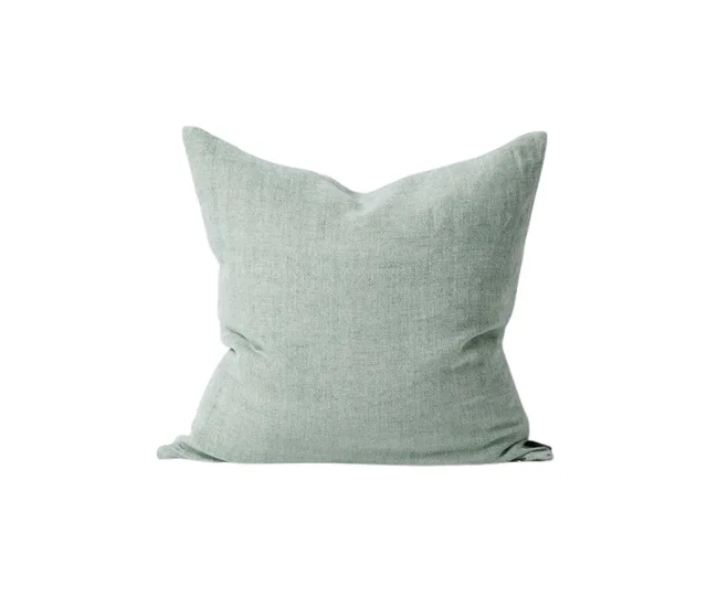 Green square pillow with a textured fabric on a plain white background.