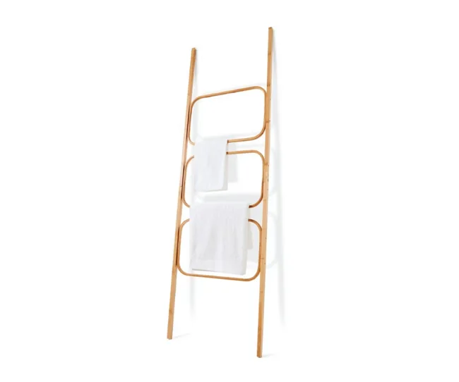 Bamboo towel ladder with three rungs, each holding a white towel, against a white background.