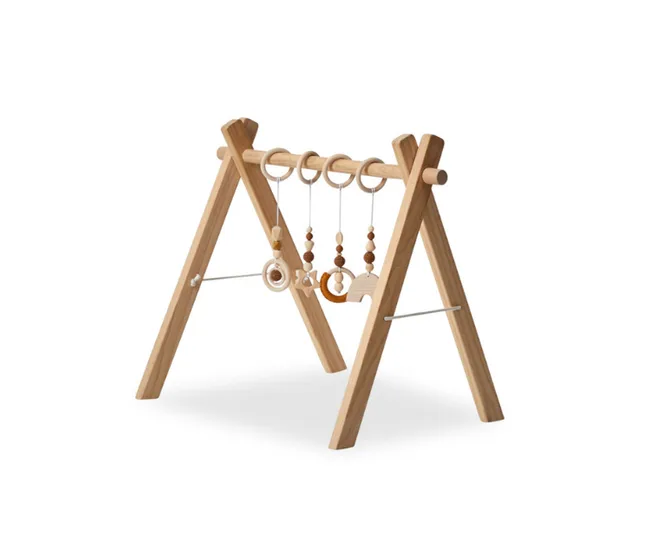 Baby wooden play gym with hanging toys and beads on an A-frame structure.
