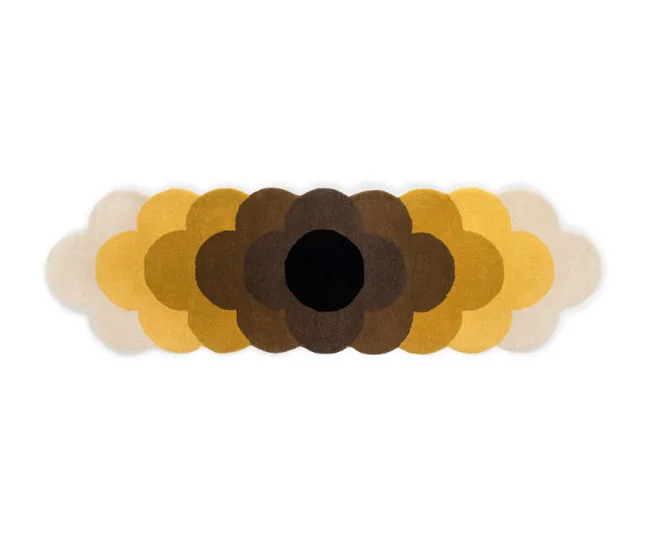 Multicolored, flower-shaped rug with overlapping petal design in shades of black, brown, yellow, and beige on white background.