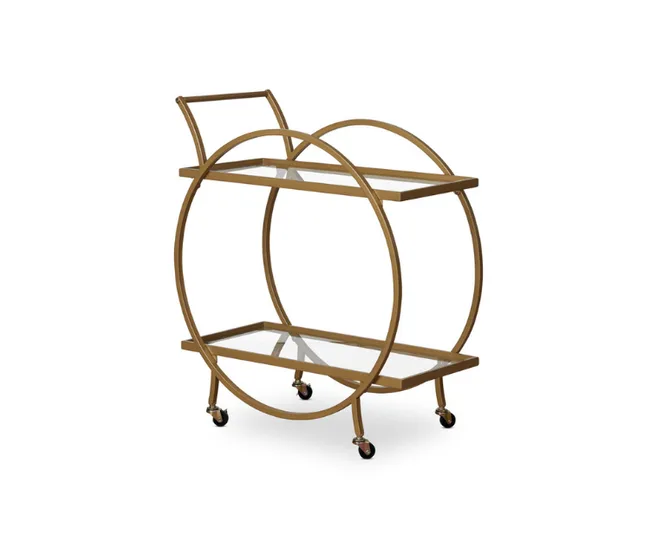 A gold circular bar cart with two glass shelves and caster wheels, designed for serving drinks.
