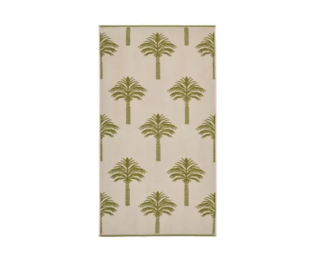 Beige towel with a repeating pattern of green palm trees.