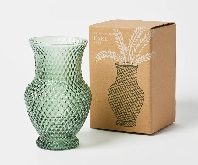Green textured glass vase next to a box showing its illustration and "Earl Vase" text.
