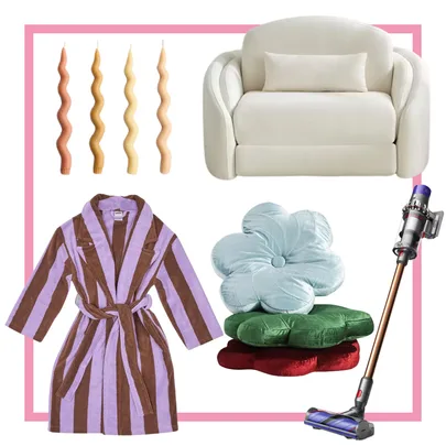 A white couch, wavy candles, striped robe, flower-shaped cushions, and a cordless vacuum.
