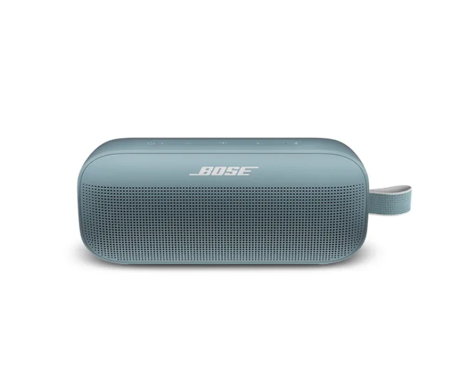 Bose SoundLink Flex portable speaker in light blue with a strap on the side, displaying the Bose logo.
