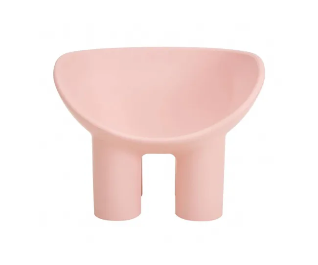A pink, modern chair with a wide seat and two thick legs, featuring a minimalist design.