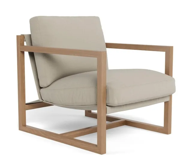 Mid-century modern beige lounge chair with wooden frame and cushioned seat and back.