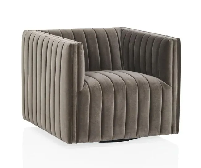 Gray velvet armchair with vertical channel tufting and a square shape.