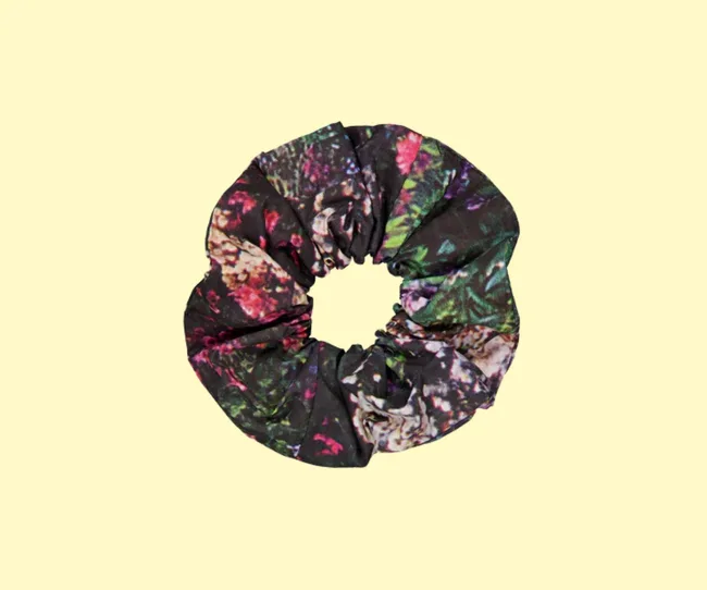 A black scrunchie with floral print