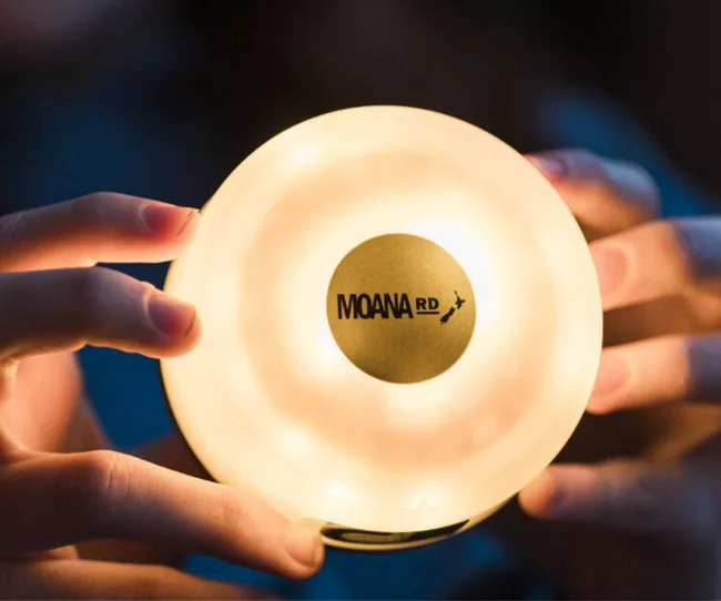 Hands holding camping light