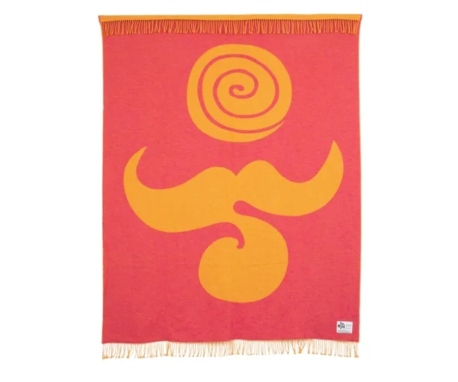 Pink and orange throw blanket with a spiral and mustache design, featuring fringe on the edges.