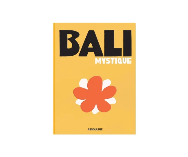 Book cover titled "Bali Mystique" with an orange flower on a yellow background. Published by Assouline.