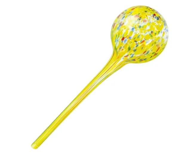 Colorful glass watering globe with a spherical top and long neck, in yellow with multicolored spots, on a white background.