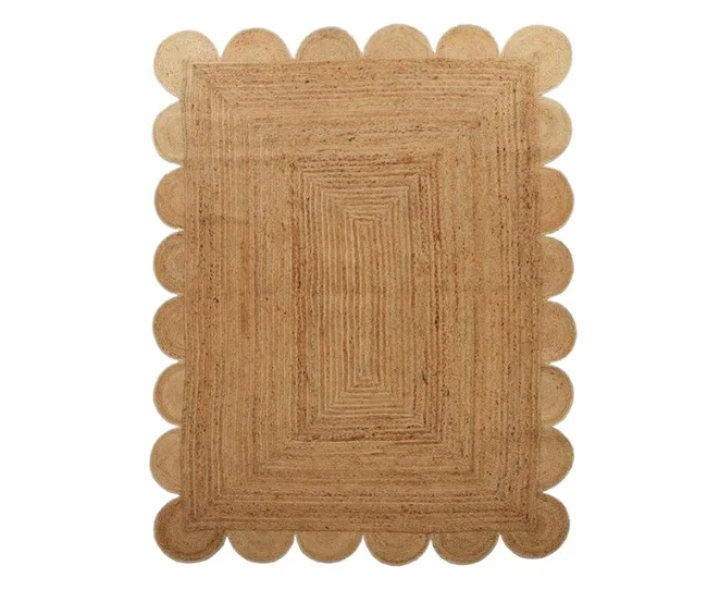 Rectangular jute rug with scalloped edges and concentric square pattern.