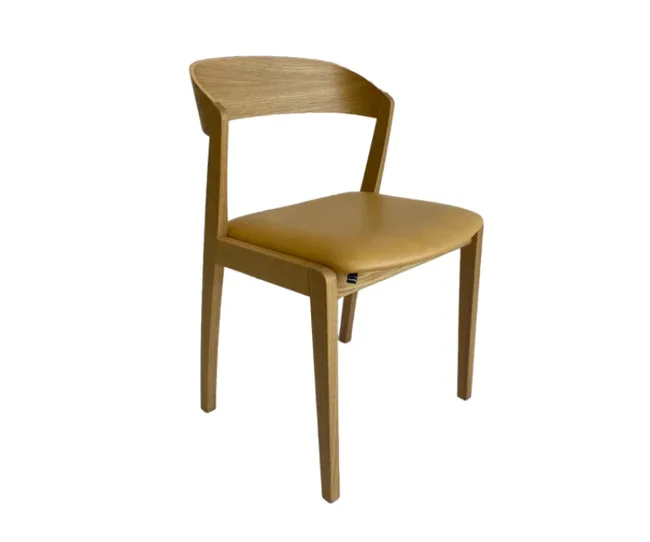 Wooden chair with curved backrest and tan leather seat.