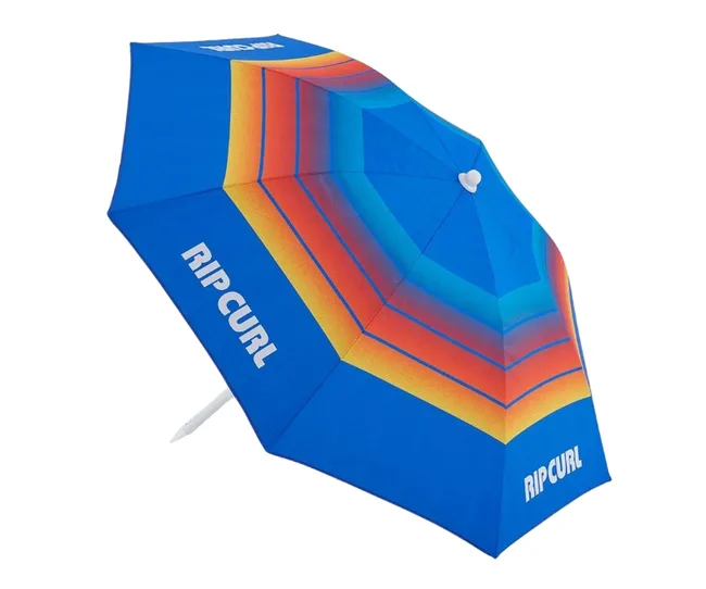 Blue beach umbrella with colorful stripes and "RIP CURL" logo in white.
